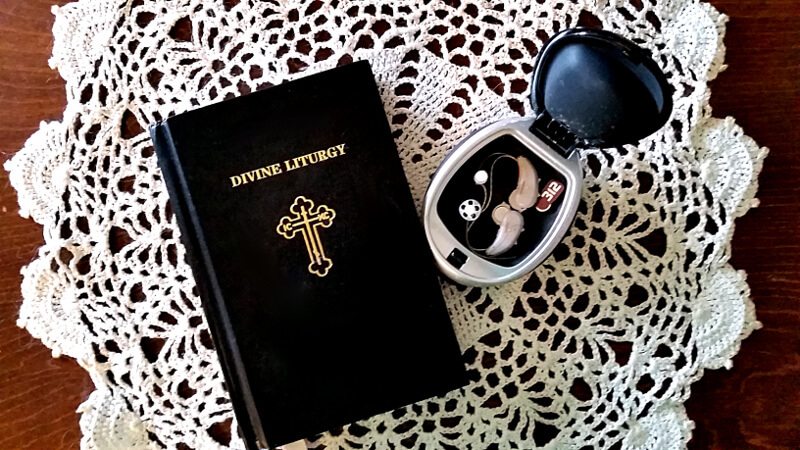 Hearing aids and a Divine Liturgy book